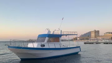 Minicrociera Riserva dello Zingaro e Tonnara di Scopello con tipica barca dei pescatori